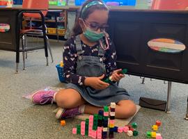 Student using counting blocks 