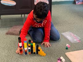 Student using counting blocks 