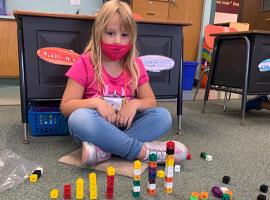Student with counting blocks 